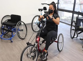 UCF student on therapy tricycle